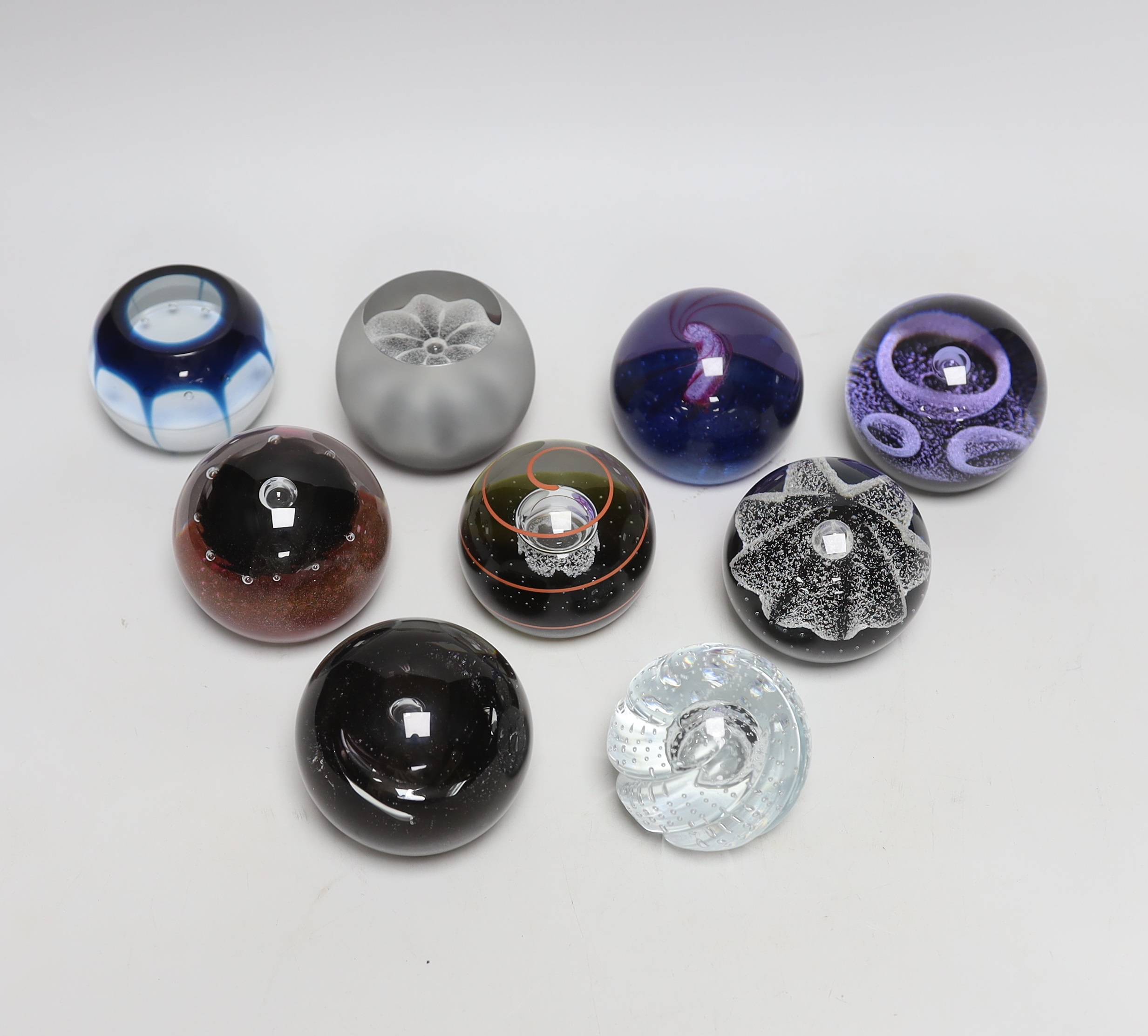 Nine Caithness paperweights including Ice Blossom, limited edition 419/1000 and Touchdown, 361/1000, each with boxes, the largest 7.5cm high